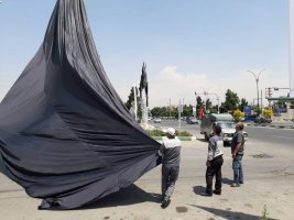 اهتزاز بیرق های مشکی بمناسبت  شب های عزاداری حضرت امیرالمومنین علی (ع) در شهرملارد